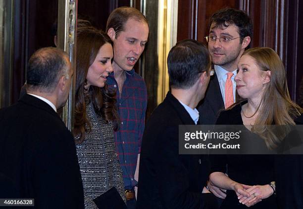 Prince William, Duke of Cambridge, and his wife, Catherine, Duchess of Cambridge, talk with Chelsea Clinton and Marc Mezvinsky as they leave after...