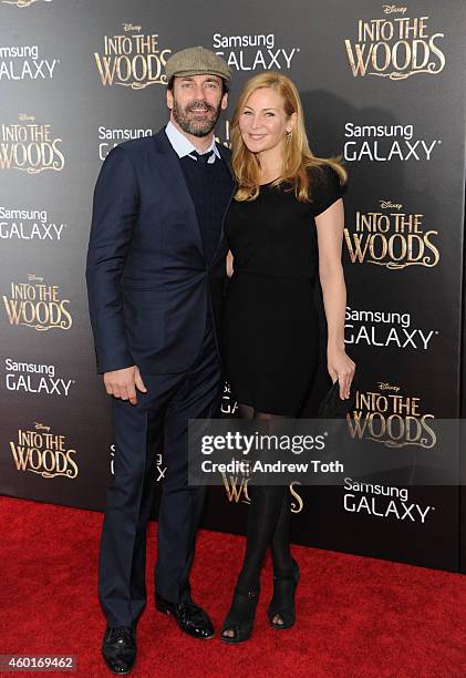 Actors Jon Hamm and Jennifer Westfeldt attend the "Into The Woods" world premiere at Ziegfeld Theater on December 8, 2014 in New York City.