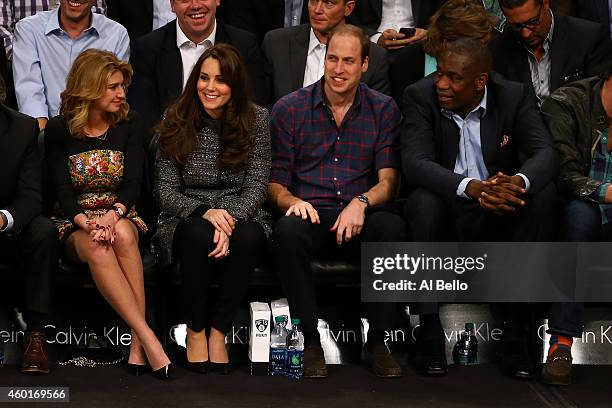 Prince William, Duke of Cambridge and Catherine, Duchess of Cambridge watch the game between the Cleveland Cavaliers and the Brooklyn Nets at...