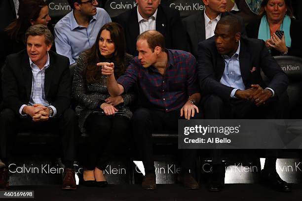 Prince William, Duke of Cambridge and Catherine, Duchess of Cambridge watch the game between the Cleveland Cavaliers and the Brooklyn Nets at...