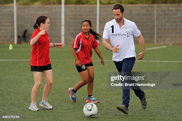 Sir Ben Ainslie interacts with school kids during his visit to Football United Festival supported by the Laureus Sport For Good Foundation on...