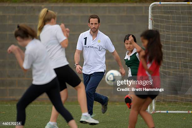 Sir Ben Ainslie interacts with school kids during his visit to Football United Festival supported by the Laureus Sport For Good Foundation on...