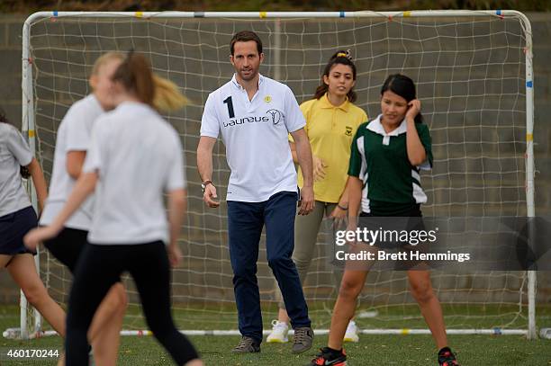 Sir Ben Ainslie interacts with school kids during his visit to Football United Festival supported by the Laureus Sport For Good Foundation on...