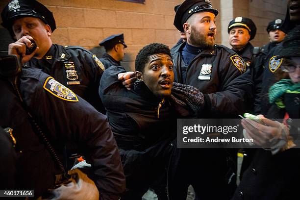 Demonstrator is arrested inside the Barclays Center subway station after a Brooklyn Nets game while protesting the Staten Island, New York grand...