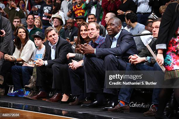 Irina Pavlova, The Duchess and Duke of Cambridge and NBA Global Ambassador Dikembe Mutombo takes in the game between the Cleveland Cavaliers against...