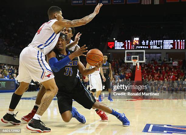 John Green of the UC Santa Barbara Gauchos dribbles the ball against Keith Frazier of the Southern Methodist Mustangs in the first half at Moody...