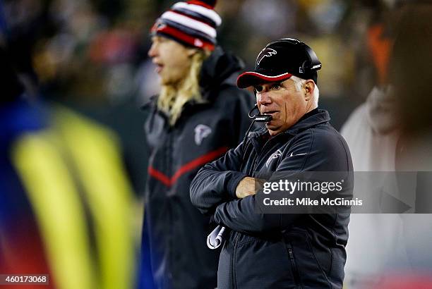 Head coach Mike Smith of the Atlanta Falcons looks on in the second quarter against the Green Bay Packers at Lambeau Field on December 8, 2014 in...