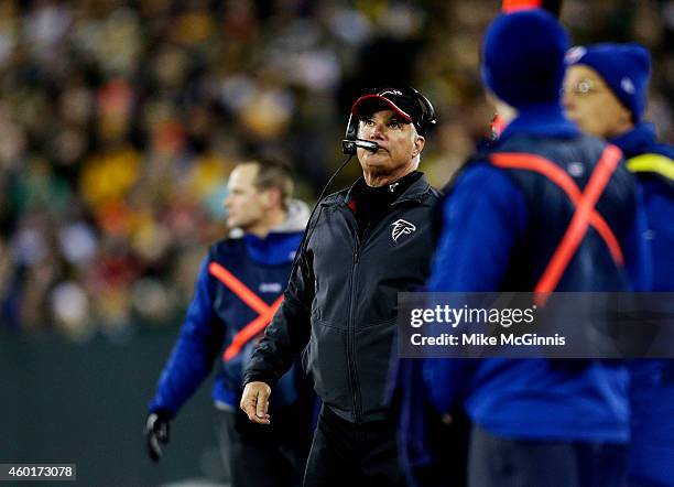 Head coach Mike Smith of the Atlanta Falcons looks on in the second quarter against the Green Bay Packers at Lambeau Field on December 8, 2014 in...