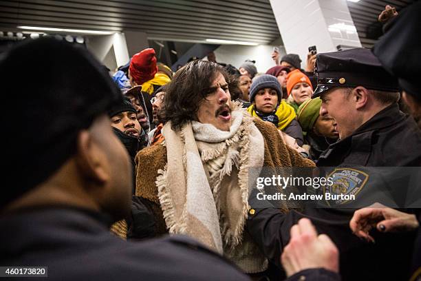 Police clash with demonstrators protesting the Staten Island, New York grand jury's decision not to indict a police officer involved in the chokehold...