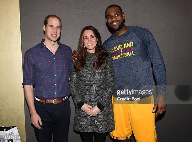 Prince William, Duke of Cambridge and Catherine, Duchess of Cambridge pose with basketball player LeBron James backstage as they attend the Cleveland...