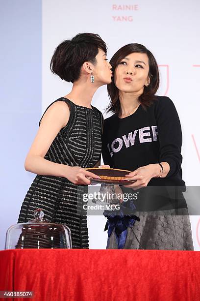 Singer Rainie Yang and singer Tanya Chua attend press conference for Rainie Yang's new album "A Tale Of Two Rainie" on December 9, 2014 in Taipei,...
