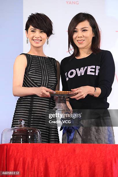Singer Rainie Yang and singer Tanya Chua attend press conference for Rainie Yang's new album "A Tale Of Two Rainie" on December 9, 2014 in Taipei,...