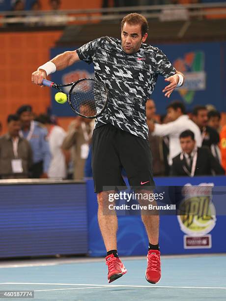 Pete Sampras of the Indian Aces plays a backhand against Patrick Rafter of the Singapore Slammers during the Coca-Cola International Premier Tennis...