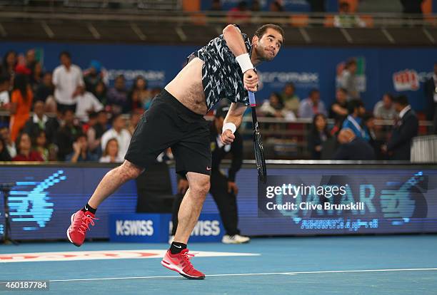 Pete Sampras of the Indian Aces serves against Patrick Rafter of the Singapore Slammers during the Coca-Cola International Premier Tennis League...