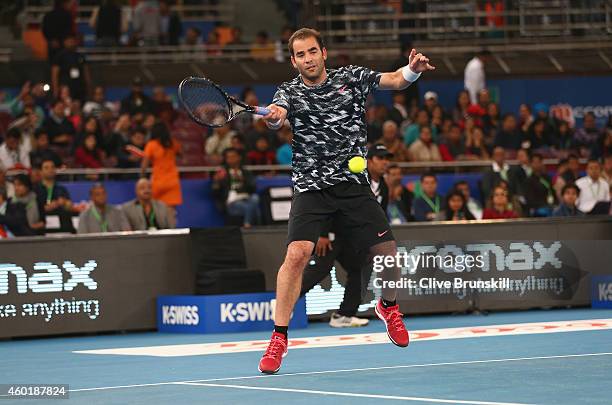 Pete Sampras of the Indian Aces plays a forehand against Patrick Rafter of the Singapore Slammers during the Coca-Cola International Premier Tennis...