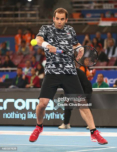 Pete Sampras of the Indian Aces plays a backhand against Patrick Rafter of the Singapore Slammers during the Coca-Cola International Premier Tennis...