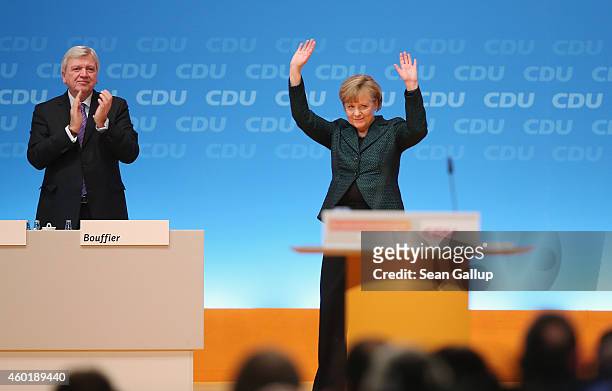 German Chancellor and Chairwoman of the German Christian Democrats Angela Merkel waves to delegates after speaking at the annual CDU party congress...