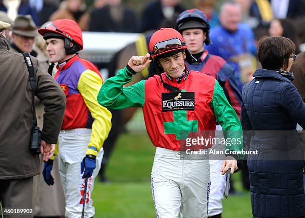 Sam Twiston-Davies greets connections in the parade ring at Fontwell racecourse on December 09, 2014 in Fontwell, England.
