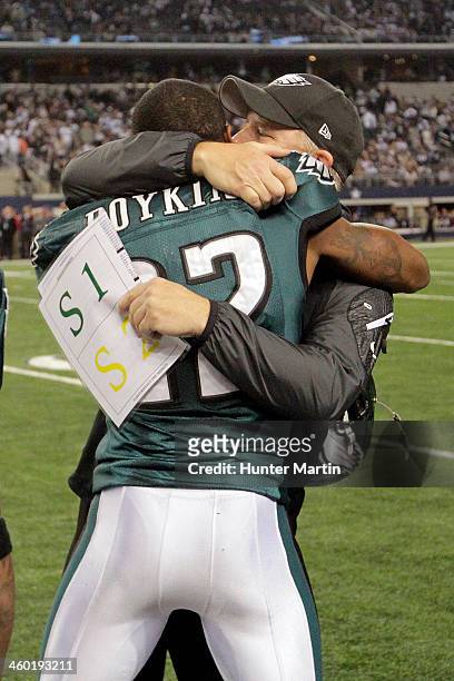 Head coach Chip Kelly of the Philadelphia Eagles hugs Brandon Boykin after his game winning interception against the Dallas Cowboys on December 29,...