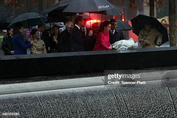 Prince William, Duke of Cambridge and Catherine, Duchess of Cambridge, lay a wreath at one of the reflecting pools at the National September 11...