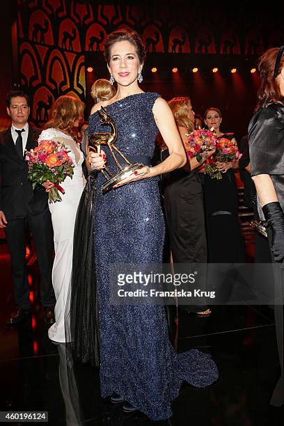 Princess Mary of Denmark poses with her award after the Bambi Awards 2014 show on November 14, 2014 in Berlin, Germany.