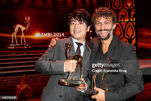 Lang Lang and Jonas Kaufmann pose with their awards after the Bambi Awards 2014 show on November 14, 2014 in Berlin, Germany.