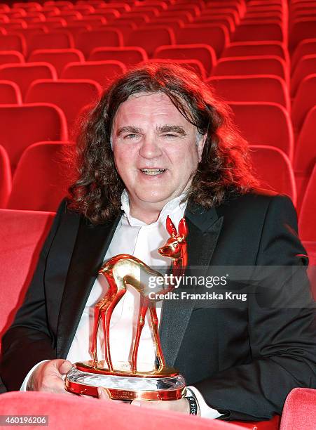 Michael Stenger poses with his award after the Bambi Awards 2014 show on November 14, 2014 in Berlin, Germany.