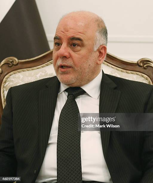 Iraqi Prime Minister Haider al-Abadi speaks during a meeting with U.S. Secretary of Defense Chuck Hage December 9, 2014 at Baghdad, Iraq. During his...