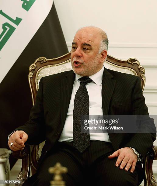 Iraqi Prime Minister Haider al-Abadi speaks during a meeting with U.S. Secretary of Defense Chuck Hage December 9, 2014 at Baghdad, Iraq. During his...