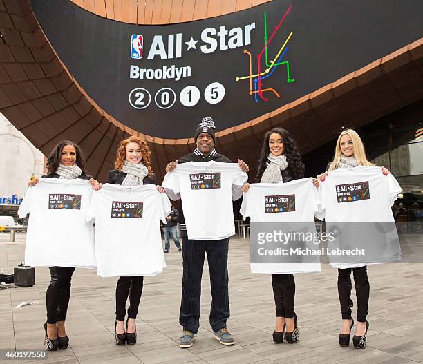 Tiny Archibald hands out All Star Tickets with Brooklynettes and poses for pictures with fans on December 5, 2014 at the Barclays Center in the...