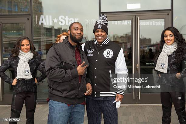 Tiny Archibald hands out All Star Tickets with Brooklynettes and poses for pictures with fans on December 5, 2014 at the Barclays Center in the...