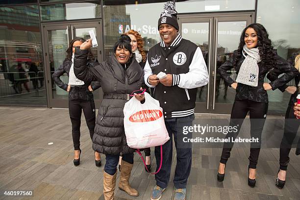 Tiny Archibald hands out All Star Tickets with Brooklynettes and poses for pictures with fans on December 5, 2014 at the Barclays Center in the...