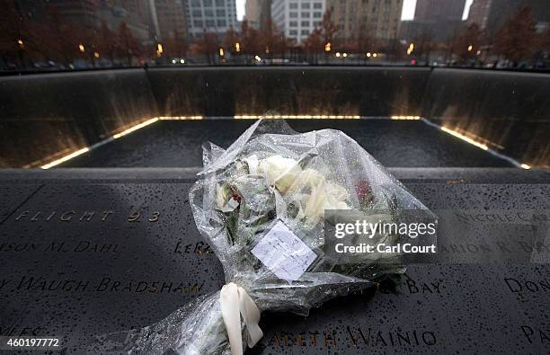 The flowers left by Prince William, Duke of Cambridge and his wife Catherine, Duchess of Cambridge, are pictured at the Memorial Reflection Pool...