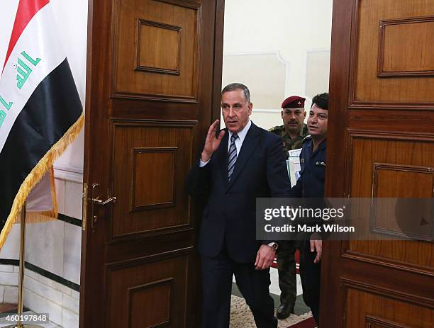 Iraqi Minister of Defense Khaled al Obeidi arrives for a meeting with U.S. Secretary of Defense Chuck Hagel, December 9, 2014 in Baghdad, Iraq....