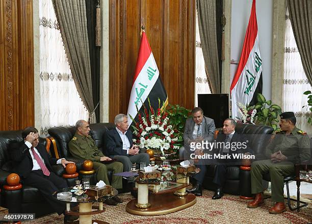 Secretary of Defense Chuck Hagel meets with Iraqi Minister of Defense Khaled al Obeidi as U.S. Ambassador to Iraq, Stuart Jones sits nearby, December...