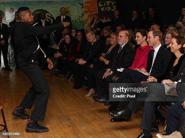 Prince William, Duke of Cambridge and Catherine, Duchess of Cambridge watch a performance during their visit to The Door on December 9, 2014 in New...