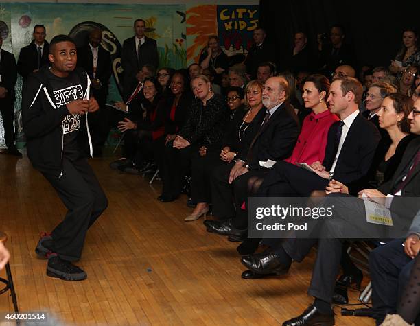 Prince William, Duke of Cambridge and Catherine, Duchess of Cambridge watch a performance during their visit to The Door on December 9, 2014 in New...