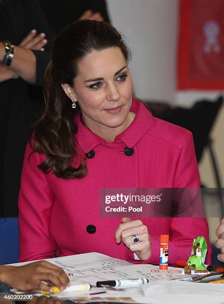 Catherine, Duchess of Cambridge speaks to people involved with CityKids during their visit to The Door on December 9, 2014 in New York City. The Door...