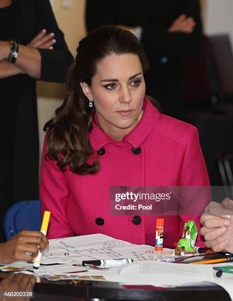 Catherine, Duchess of Cambridge speaks to people involved with CityKids during their visit to The Door on December 9, 2014 in New York City. The Door...