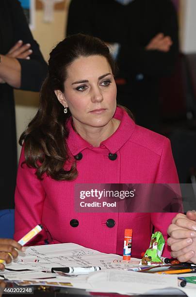 Catherine, Duchess of Cambridge speaks to people involved with CityKids during their visit to The Door on December 9, 2014 in New York City. The Door...