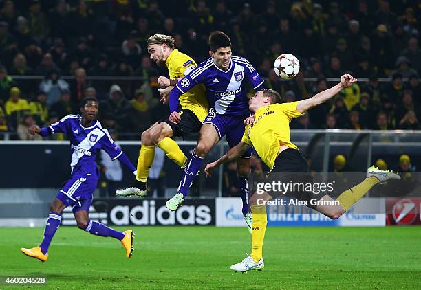 Marcel Schmelzer of Borussia Dortmund and Matthias Ginter of Borussia Dortmund challenge for the ball with Aleksandar Mitrovic of Anderlecht during...