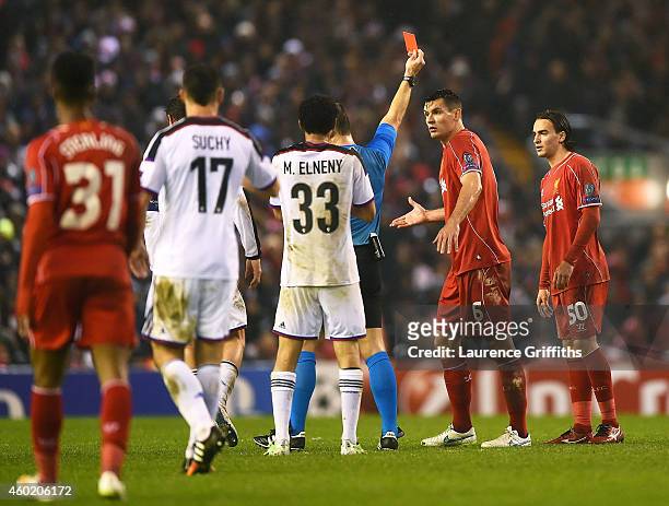 Dejan Lovren of Liverpool reacts as teammate Lazar Markovic of Liverpool is shown the red card card during the UEFA Champions League group B match...