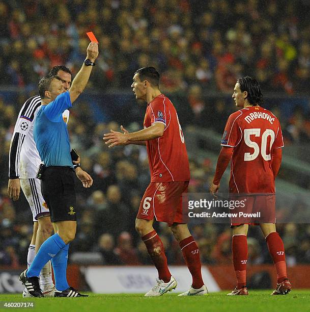 Lazar Markovic of Liverpool is shown the red card by Referee Bjorn Kuipers during the UEFA Champions League match between Liverpool FC and FC Basel...