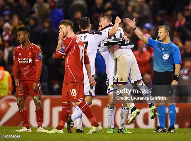 Basel players celebrate their team's 1-1 draw as the final whistle blows during the UEFA Champions League group B match between Liverpool and FC...