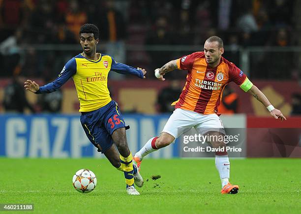 Gedion Zelalem of Arsenal skips past Wesley Sneijder of Galatasaray during the match between Galatasaray and Arsenal in the UEFA Champions League on...