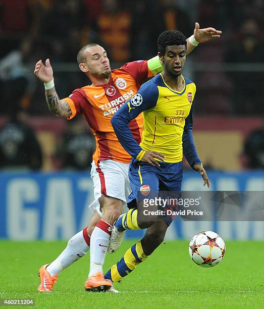 Gedion Zelalem of Arsenal skips past Wesley Sneijder of Galatasaray during the match between Galatasaray and Arsenal in the UEFA Champions League on...