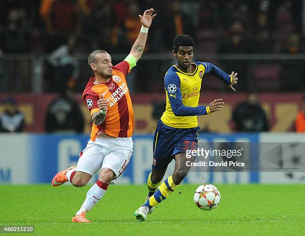 Gedion Zelalem of Arsenal skips past Wesley Sneijder of Galatasaray during the match between Galatasaray and Arsenal in the UEFA Champions League on...