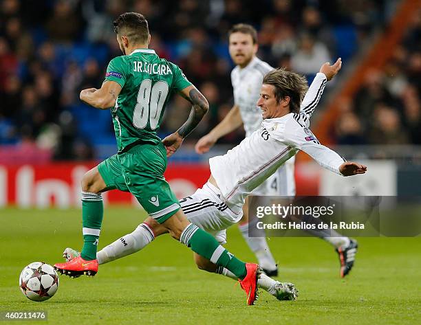 Fabio Coentrao of Real Madrid and Junior Caicara of Ludogorest pfc compete for the ball during the UEFA Champions League Group B match between Real...
