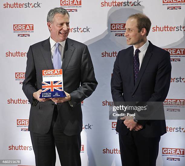 Prince William, Duke of Cambridge poses with New York City Mayor Bill de Blasio during the Innovation is GREAT Reception at Shutterstock headquarters...