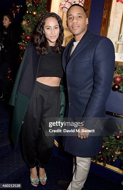 Tia Ward and Reggie Yates attend the Sunday Times Style Xmas Party at Tramp on December 9, 2014 in London, England.
